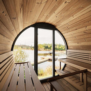 SaunaLife Model EE8G outdoor barrel sauna with wooden exterior and glass door, designed for relaxing outdoor wellness experiences.