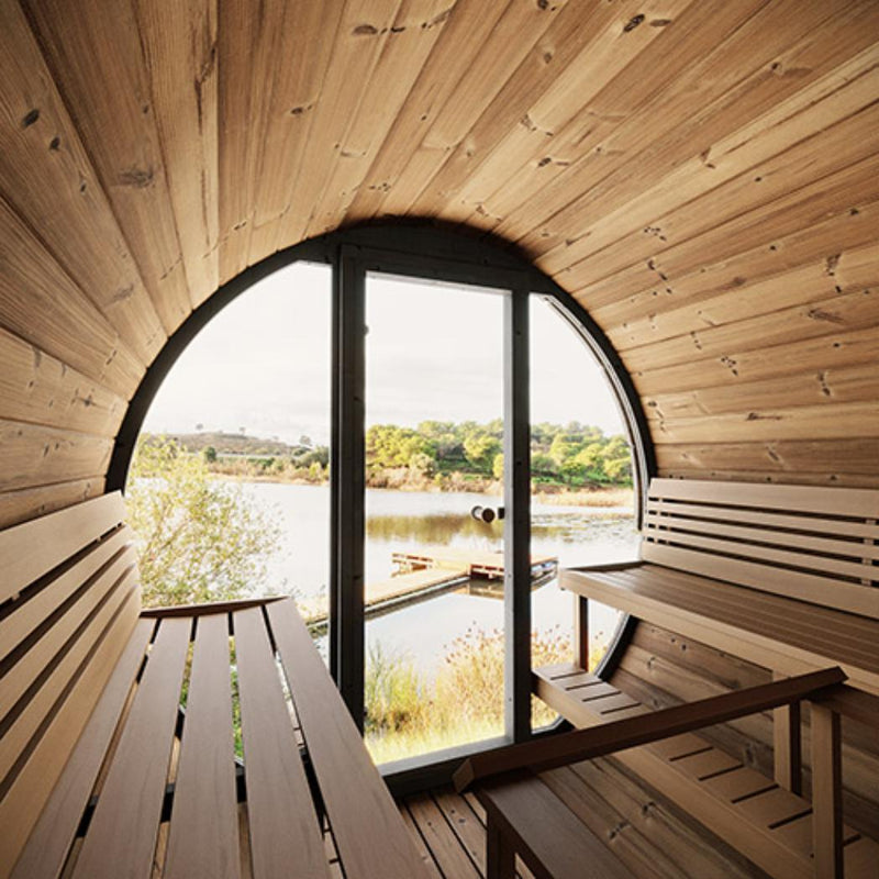 SaunaLife Model EE8G outdoor barrel sauna with wooden exterior and glass door, designed for relaxing outdoor wellness experiences.