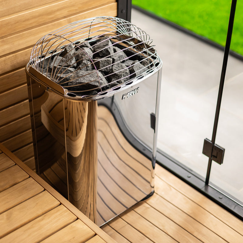Harvia Club K10G sauna heater installed beside a glass sauna wall