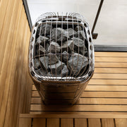 Harvia Club heater in a wood sauna with glass partition