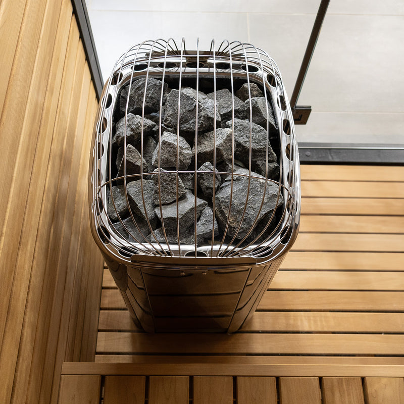 Harvia Club heater in a wood sauna with glass partition