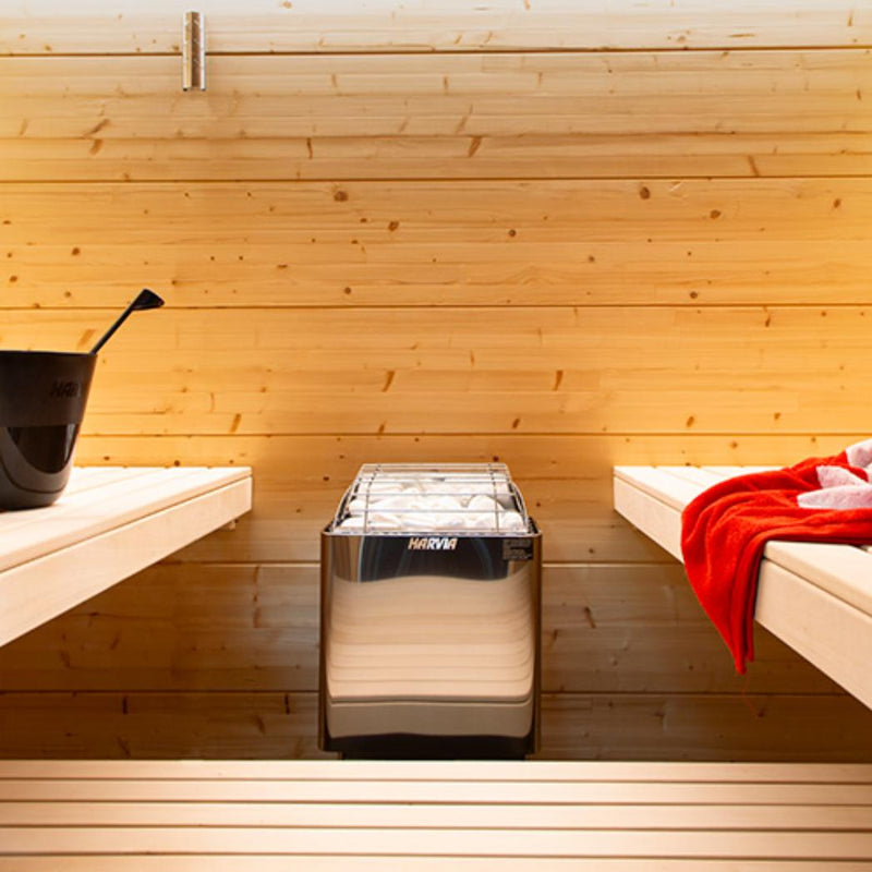 Harvia KIP60W electric sauna heater with black metal exterior and control panel, designed for home sauna heating.