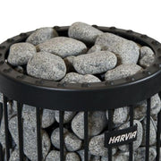 Harvia R-991 sauna heater stones in a basket, ready for installation in a traditional sauna heater system.
