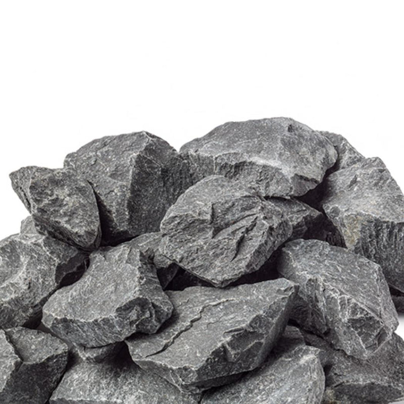 Harvia AC3000 sauna heater stones arranged in a pile, ready for installation in a sauna heater for optimal heat distribution.
