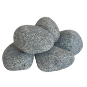 Harvia R-991 sauna heater stones stacked inside a sauna heater, ready for use in a traditional sauna heating system.
