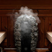 Harvia Spirit SP90E sauna heater in use, showcasing its sleek design and heating elements inside a modern sauna.