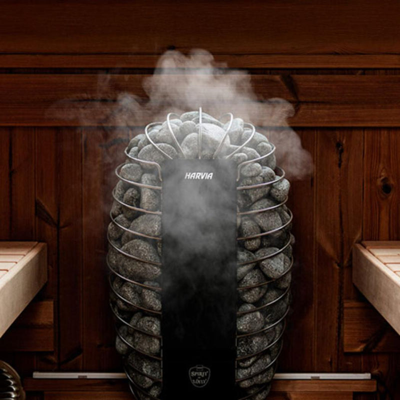 Harvia Spirit SP90E sauna heater in use, showcasing its sleek design and heating elements inside a modern sauna.