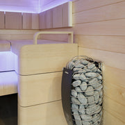 Harvia Spirit heater installed in a contemporary light-wood sauna with LED lighting