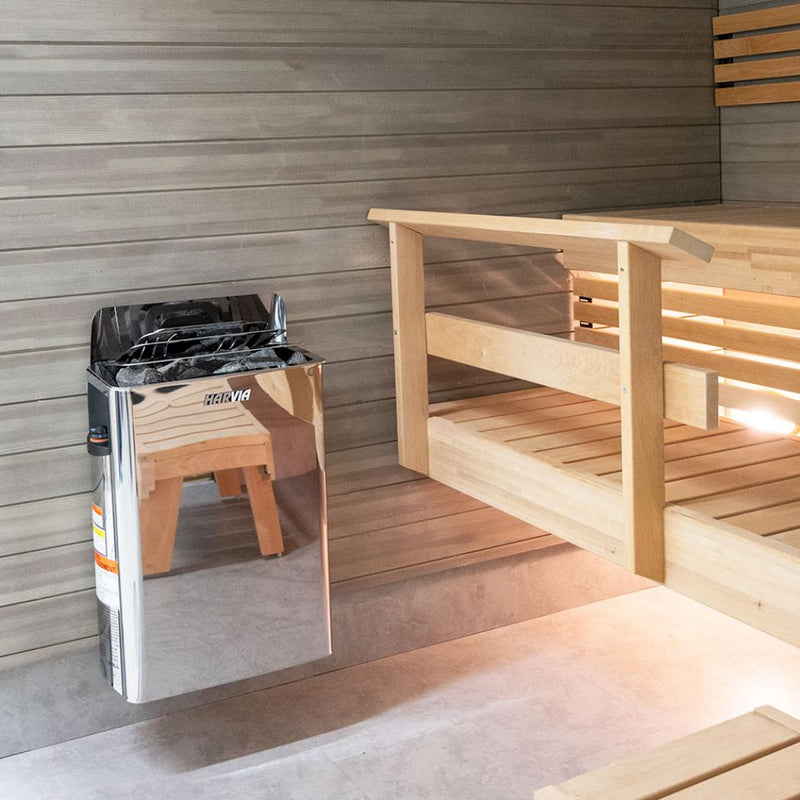Harvia The Wall SWS80 sauna heater in polished stainless steel with control panel and heating elements for home sauna.