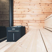 Harvia Virta Combi HL90SA sauna heater with black exterior and control panel, designed for home sauna heating.