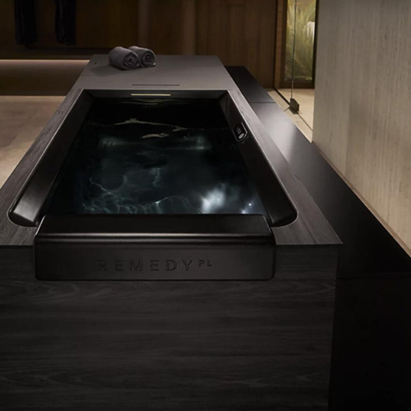 Kohler Remedy Place cold plunge ice bath in sleek white with stainless steel faucet, designed for relaxation and recovery.
