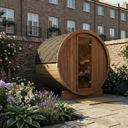 SaunaLife E6 barrel sauna in a walled flower garden courtyard