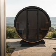 SaunaLife EE8G barrel sauna on a stone patio with mountain views