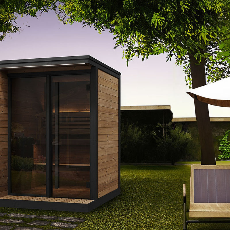 SaunaLife GL4 outdoor sauna beside a patio lounge area under a tree