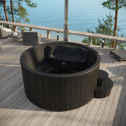 SaunaLife Model S4B wood burning hot tub with wooden panels and seating, designed for outdoor relaxation and thermal comfort.
