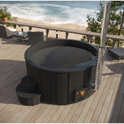 SaunaLife Model S4B wood burning hot tub with wooden exterior and seating, outdoors in a natural setting.