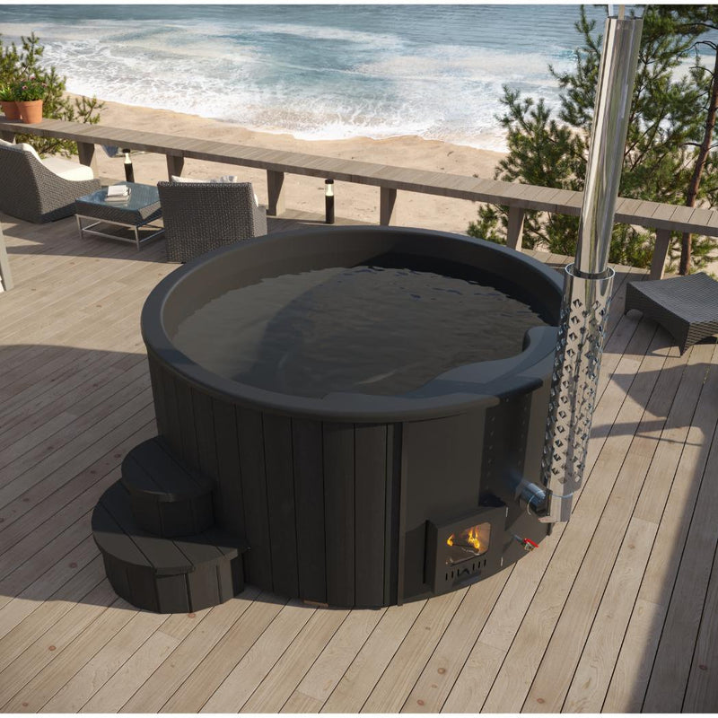 SaunaLife Model S4B wood burning hot tub with wooden exterior and seating, outdoors in a natural setting.