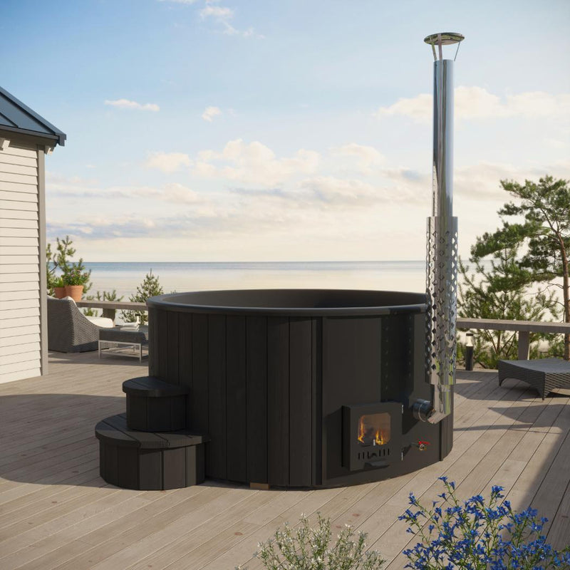 SaunaLife Model S4B wood burning hot tub with wooden exterior and open seating area, set outdoors in a natural environment