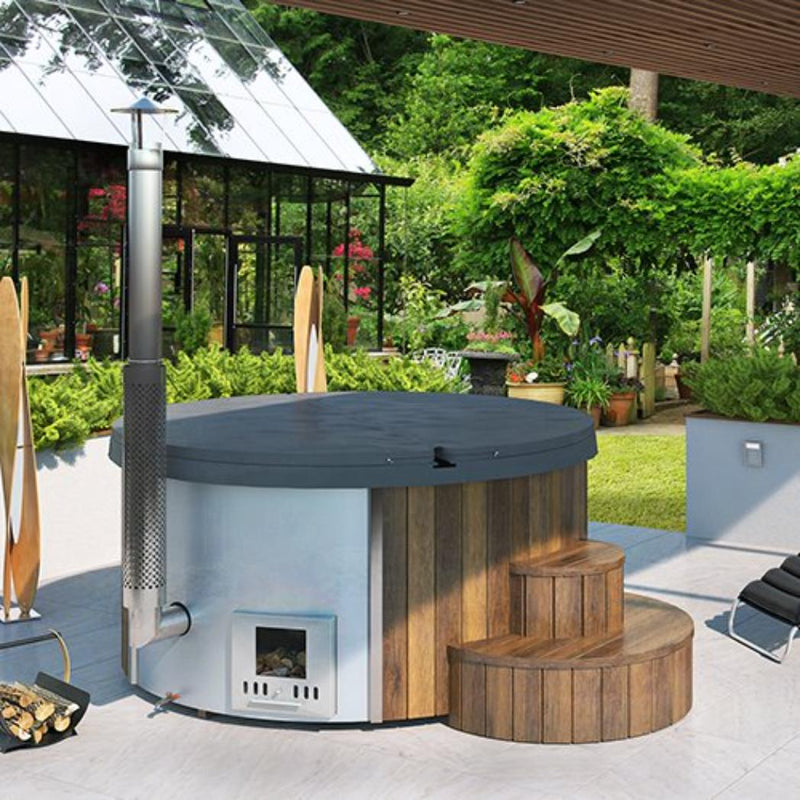 SaunaLife Model S4N wood burning hot tub with natural wood finish, showing the round shape and built-in seating outdoors.