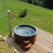 SaunaLife S4N wood-fired hot tub filled and heating on a hillside deck