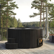 SaunaLife Model S6B wood burning hot tub with wooden exterior and open seating area, set outdoors for relaxation.