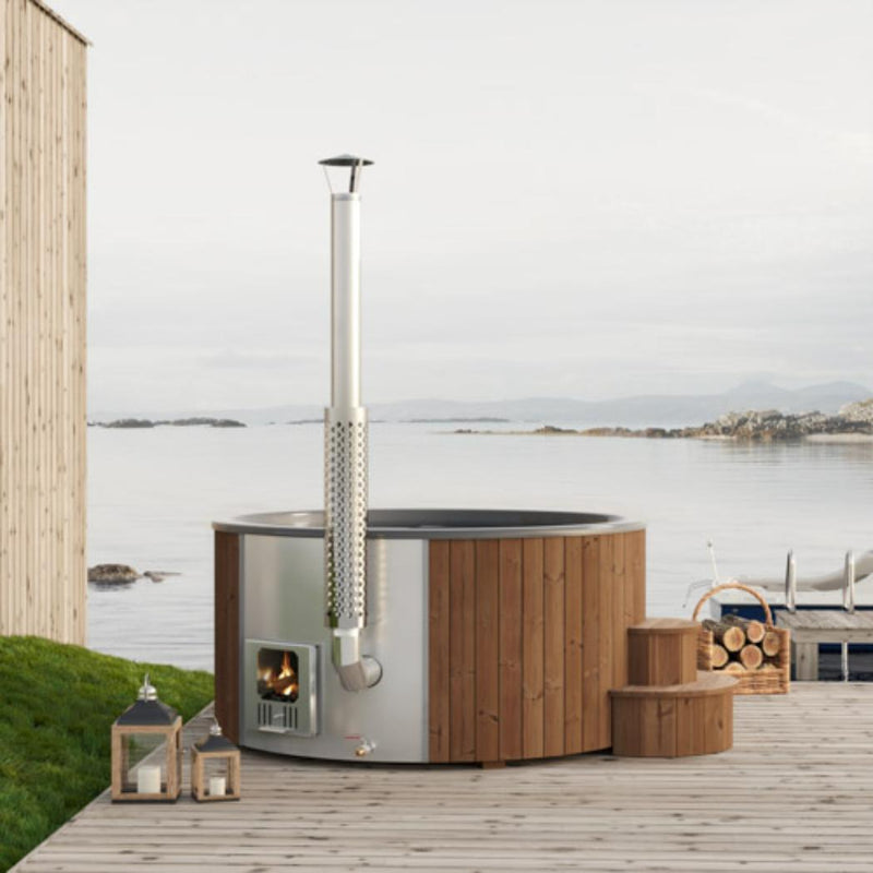 SaunaLife Model S6N wood-burning hot tub filled with water, featuring wooden exterior and seating area for outdoor relaxation.