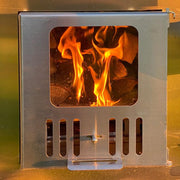 SaunaLife Model S4B wood burning hot tub filled with water, showcasing wooden exterior and cozy outdoor setting