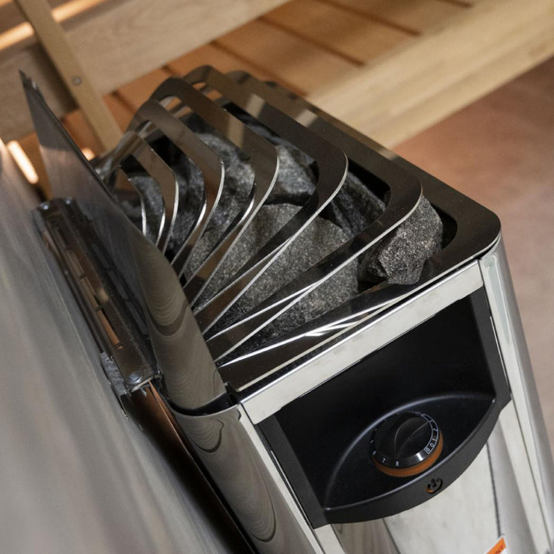 Harvia The Wall SWS80 sauna heater with digital controls, mounted on a wall, featuring a sleek black design and heating stones inside.